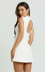 Langley Mini Dress Sleeveless High Neck Faux Wrap Tulip Dress in Cream